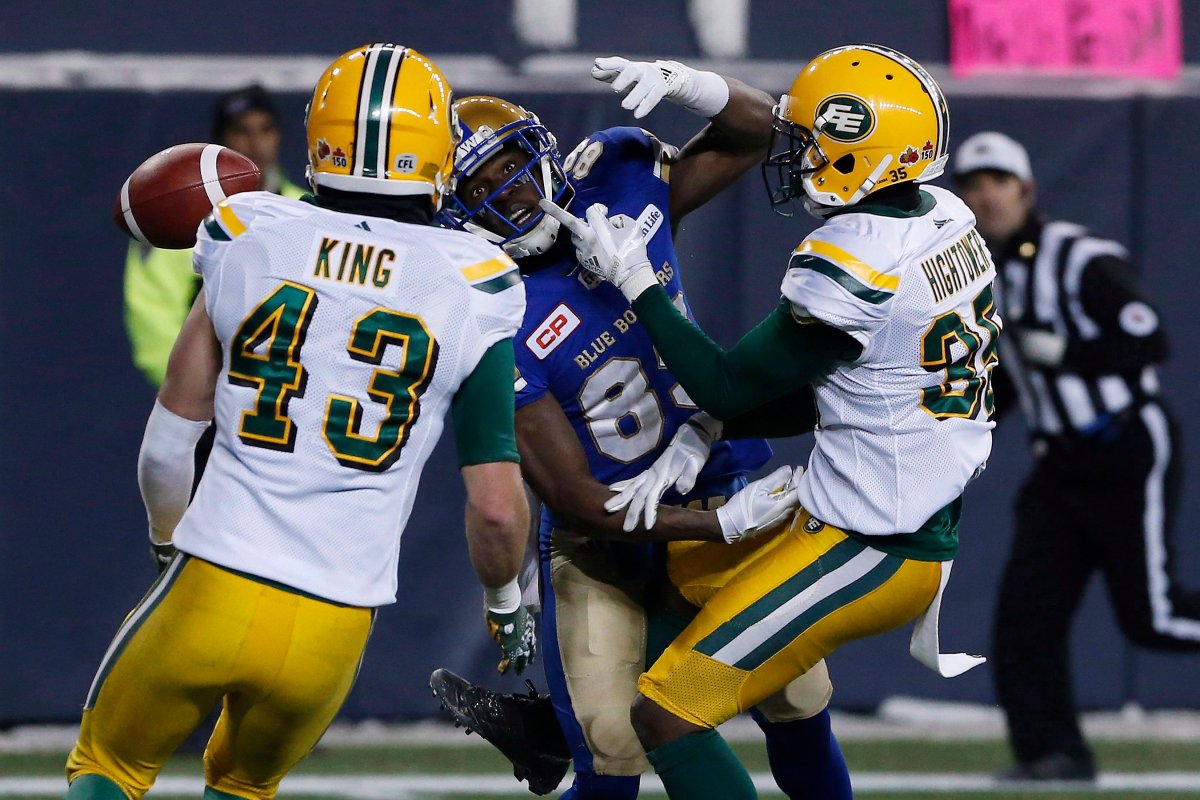 Winnipeg Blue Bombers' Clarence Denmark (89) can't make the catch as he's covered by Edmonton Eskimos' Forrest Hightower (35) and Neil King (43) during second half CFL western semifinal action in Winnipeg on Sunday, November 12, 2017. 