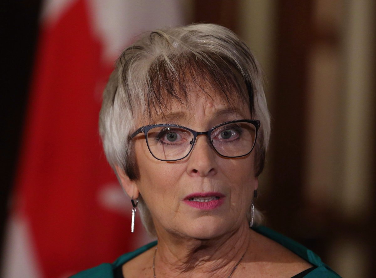 New Brunswick Finance Minister Cathy Rogers takes questions from reporters before joining her federal, provincial and territorial counterparts for dinner in Ottawa, Sunday, December 10, 2017. 