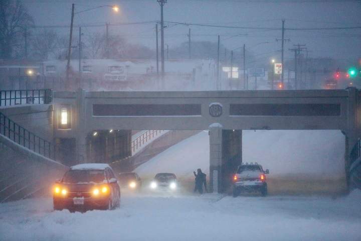 Multiple cars are stuck in the snow and ice on Monticello Ave under the railroad overpass on Thursday, Jan. 4, 2018 in Norfolk, Va. Virginia has been socked by a powerful winter blast of snow and cold thatÄôs seldom seen along its coast.   