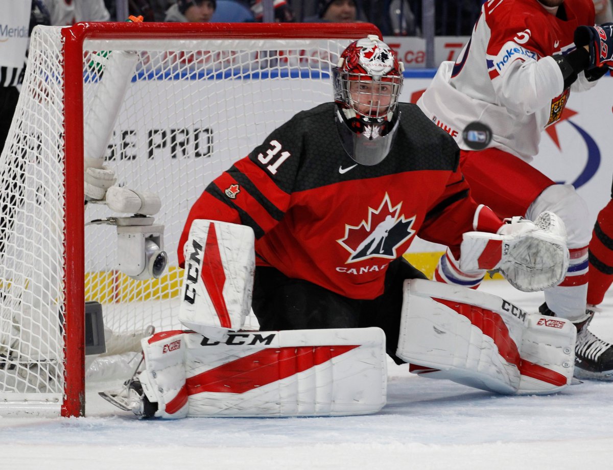 Canada goalie Carter Hart (31) makes a save during the first period against the Czech Republic in a semifinal in the IIHF world junior hockey championships Thursday, Jan. 4, 2018, in Buffalo, N.Y. (AP Photo/Jeffrey T. Barnes).