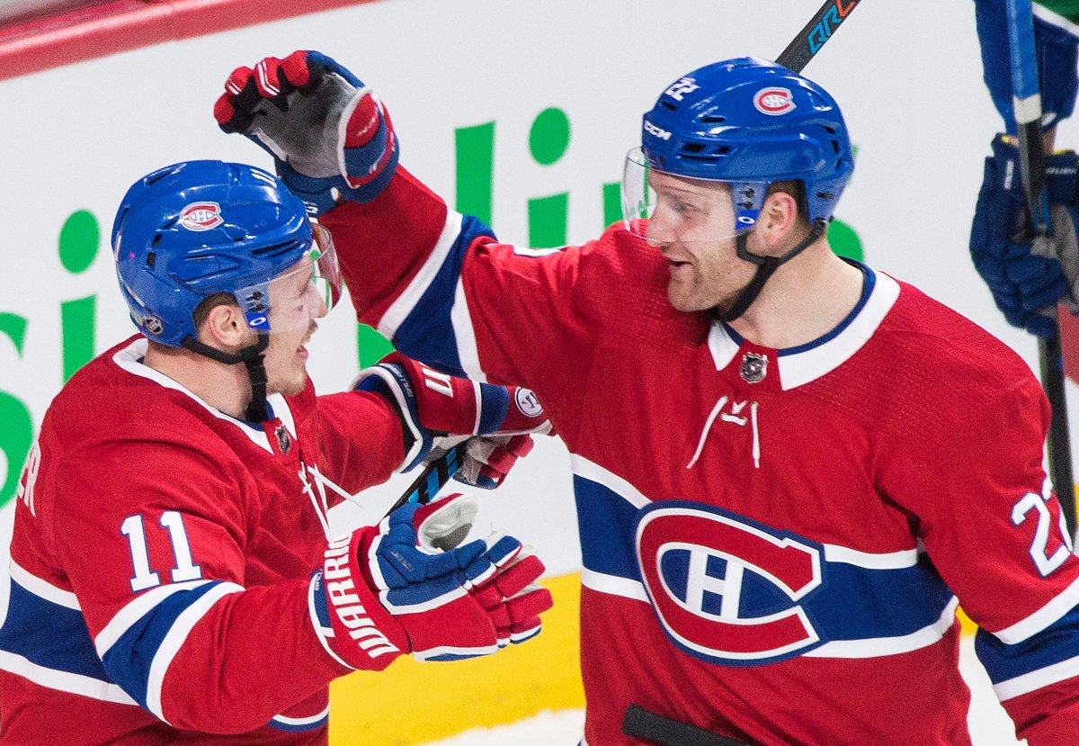 Montreal Canadiens' Karl Alzner celebrates with teammate Brendan Gallagher after scoring against the Vancouver Canucks. Sunday, January 7, 2018.