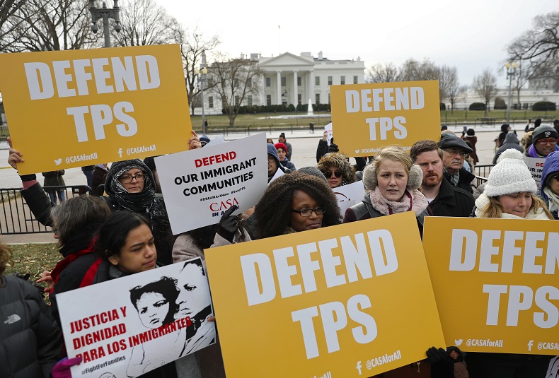 CASA de Maryland, an immigration advocacy and assistance organization, holds a rally in Lafayette Park, across from the White House in Washington, Monday, Jan. 8, 2018, in reaction to the announcement regarding Temporary Protective Status for people from El Salvador.