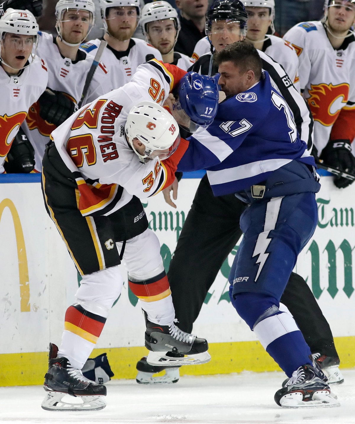 Calgary Flames right wing Troy Brouwer (36) and Tampa Bay Lightning left wing Alex Killorn (17) fight during the first period of an NHL hockey game Thursday, Jan. 11, 2018, in Tampa, Fla. Both players were given fighting major penalties. (AP Photo/Chris O'Meara).