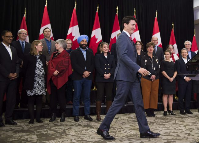 Prime Minister Justin Trudeau enters the room to address the media during his closing comments after attending the Liberal cabinet retreat in London, Ont., Jan. 12, 2018. 