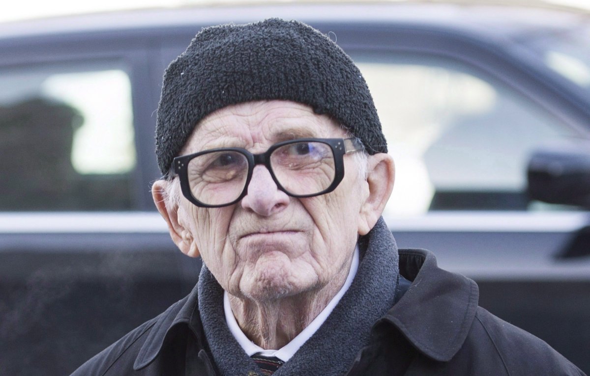 Former sportswriter Red Fisher arrives for the funeral of Montreal Canadiens' hockey legend Dickie Moore at the Mountainside United Church, in Montreal, on Monday, Dec. 28, 2015. 