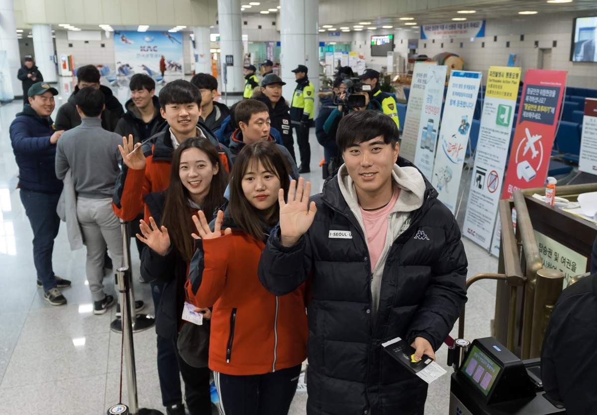 South Korean skiers wave at Yangyang Airport on South Korea's east coast in Yangyang County, South Korea, 31 January 2018, before departing for Kalma Airport in North Korea's eastern city of Wonsan en route to the North's Masikryong Ski Resort. 