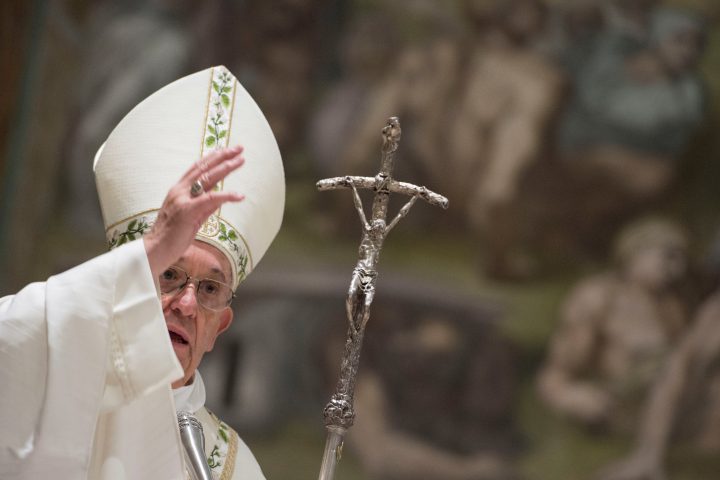 Pope Francis blesses during a solemn mass in the Sistine Chapel at the Vatican, Jan. 7, 2018. 