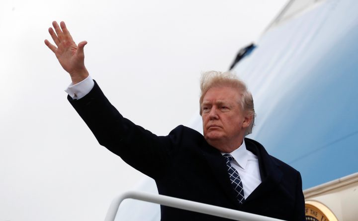 U.S. President Donald Trump waves as he boards Air Force One upon departure from Joint Base Andrews in Maryland, U.S., Jan. 12, 2018.  