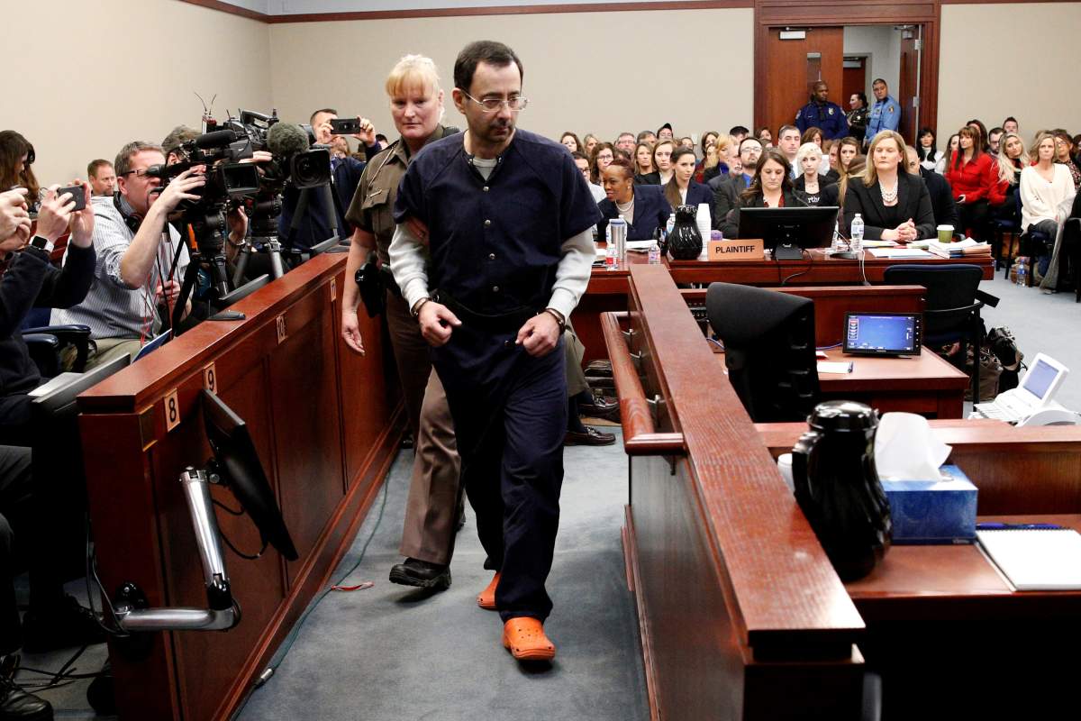 Larry Nassar, a former team USA Gymnastics doctor who pleaded guilty in November 2017 to sexual assault charges, is escorted into the courtroom during his sentencing hearing in Lansing, Michigan, U.S., January 24, 2018. 