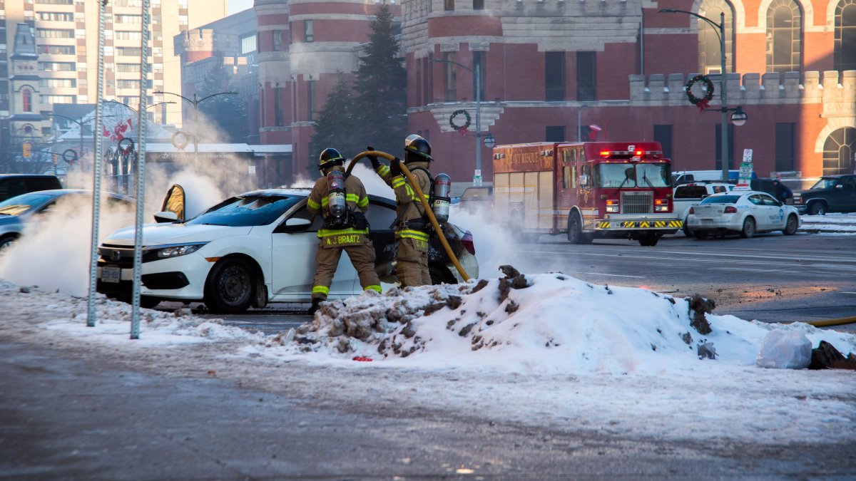 Firefighters tackle a vehicle fire on Dundas St., just east of Wellington Rd. 
