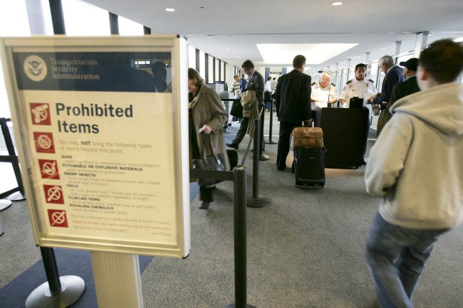 File photo of airline passengers lining up at a TSA security check point at Newark Liberty International Airport in Newark, N.J.