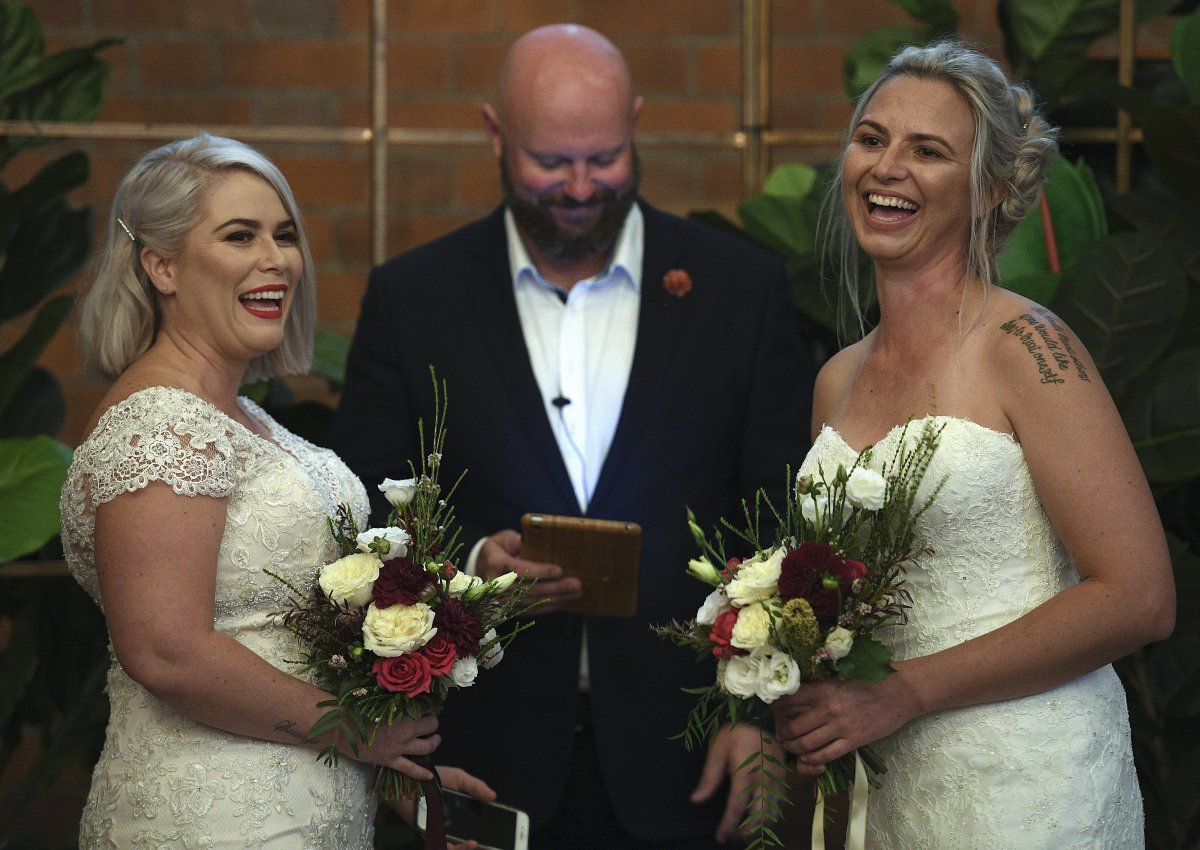 Rebecca Hickson (L) and Sarah Turnbull are married in a ceremony in Newcastle, New South Wales, Australia.