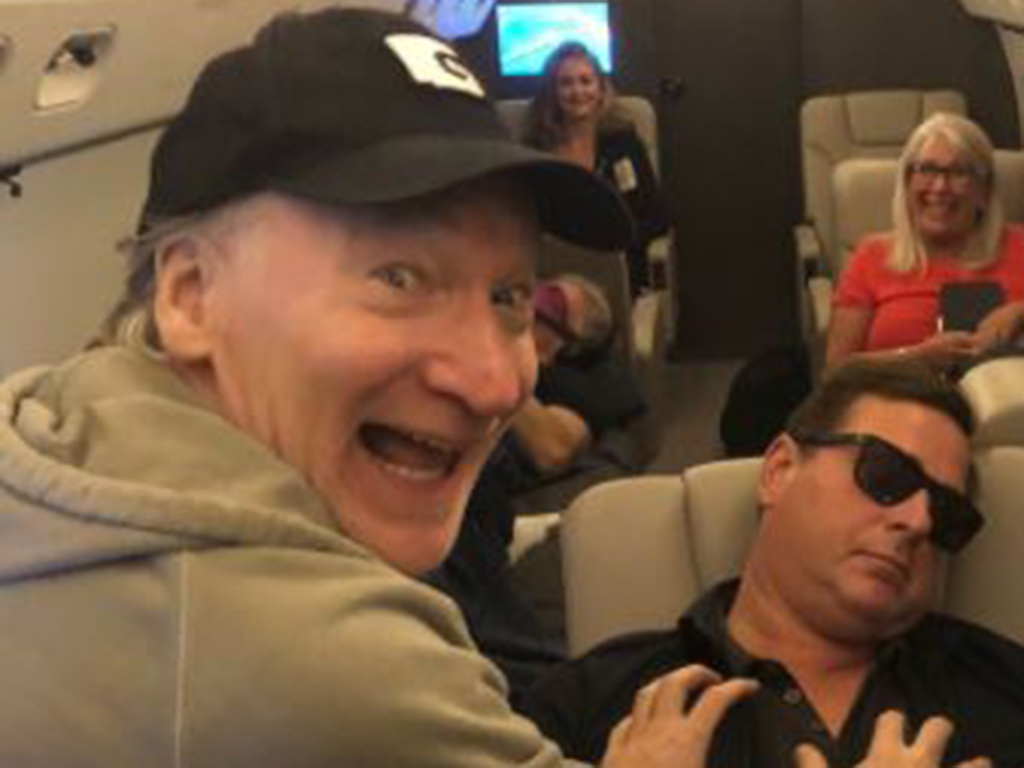 Bill Maher goes to grab Bob Saget's chest in a reenactment of a 2006 photo of ex-senator Al Franken.