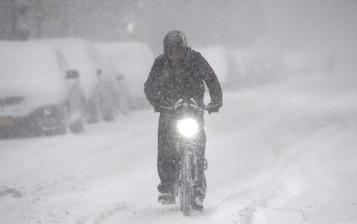 A man rides a bicycle on January 4, 2018 in Brooklyn, New York.