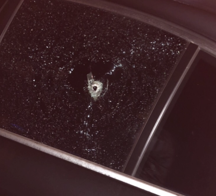 A bullet hole in the window of the car Ralph was driving in. He said he didn’t realize he’d been shot until police pointed it out.