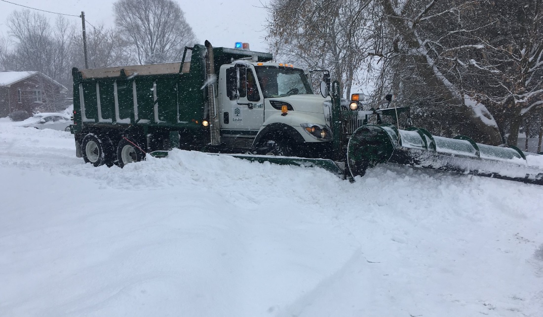 A snowplow clearing snow after a snow fall