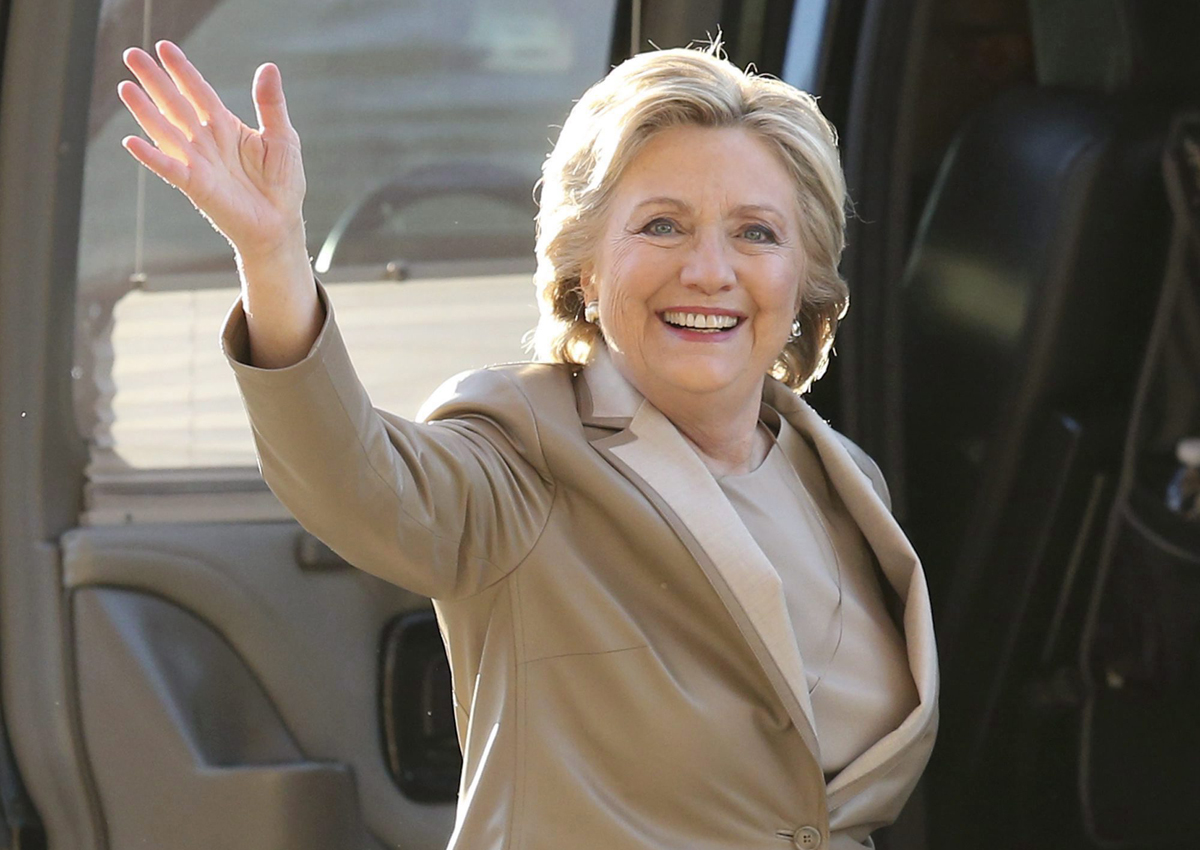 In this Nov. 8, 2016 file photo, Democratic presidential candidate Hillary Clinton waves as she arrives to vote at her polling place in Chappaqua, N.Y. 