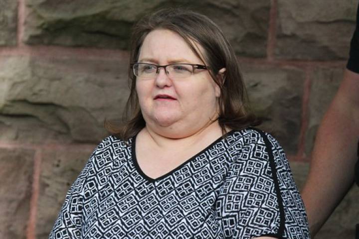 Elizabeth Wettlaufer is escorted by police from the courthouse in Woodstock, Ont, Monday, June 26, 2017.

