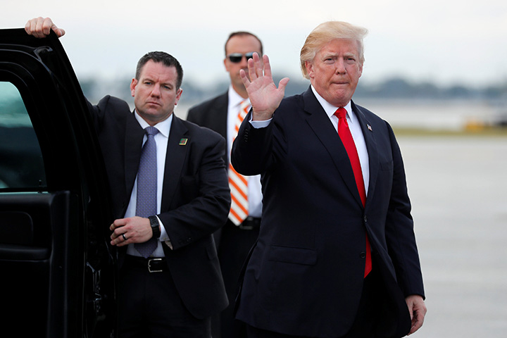 U.S. President Donald Trump arrives to board Air Force One to return to Washington from Palm Beach International Airport in West Palm Beach, Florida, January 1, 2018. 