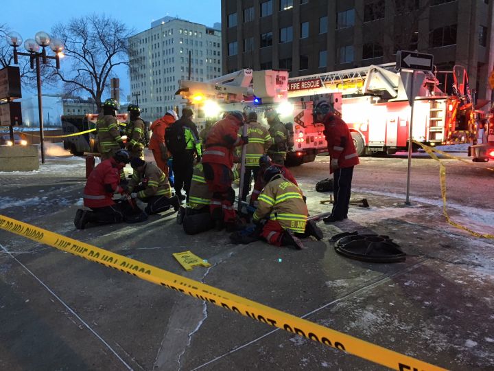 Woman falls down maintenance hole after electrical explosion in