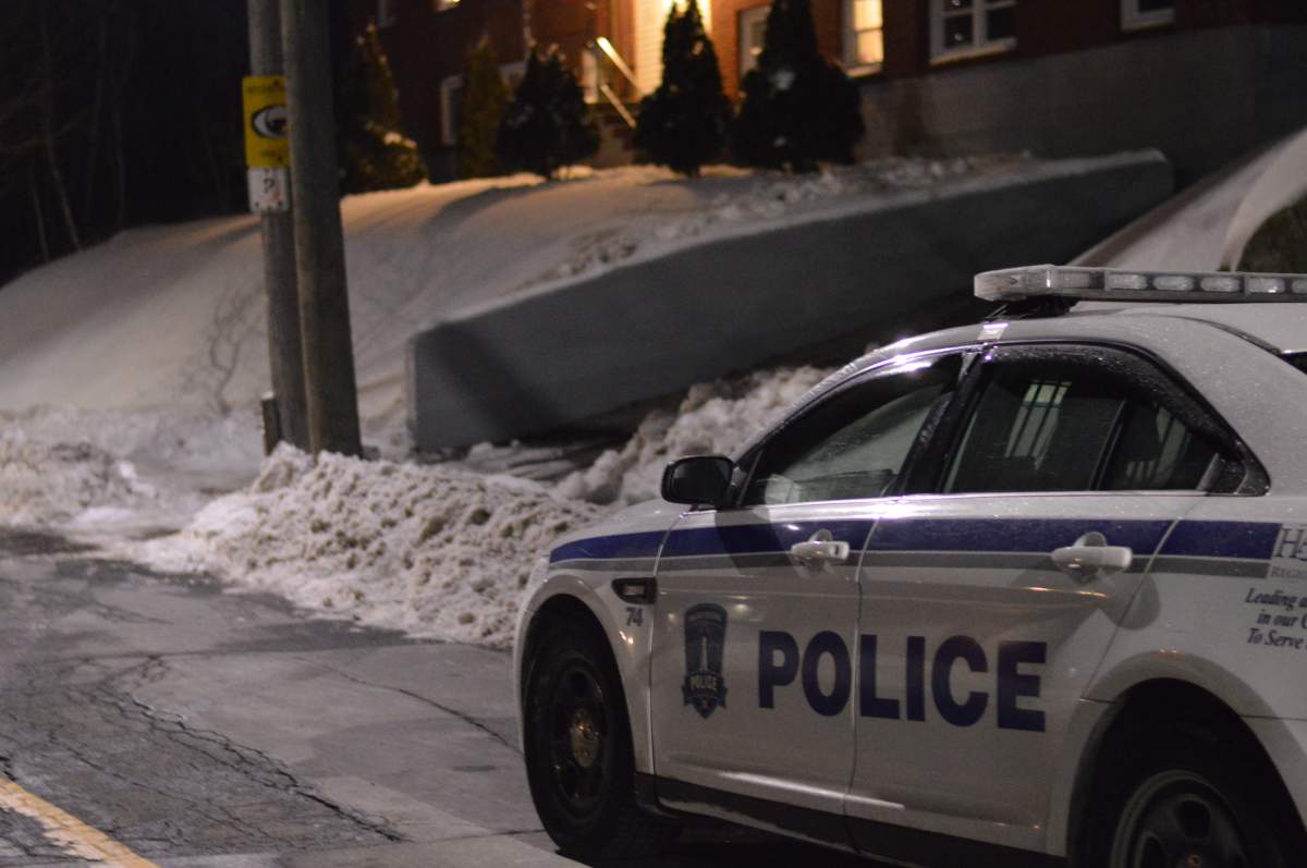 Police are seen investigating a suspicious death at a building on Pinecrest Drive in Dartmouth, N.S., on Jan. 19, 2018. The death was declared a homicide the next day.