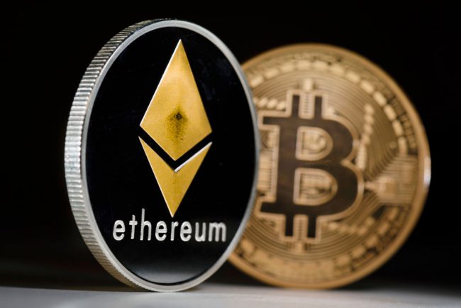 Berlin, Germany - January 09: Coins of the cryptocurrencies Ethereum and Bitcoin stands on a table on January 09, 2018 in Berlin, Germany. (Photo by Thomas Trutschel/Photothek via Getty Images).