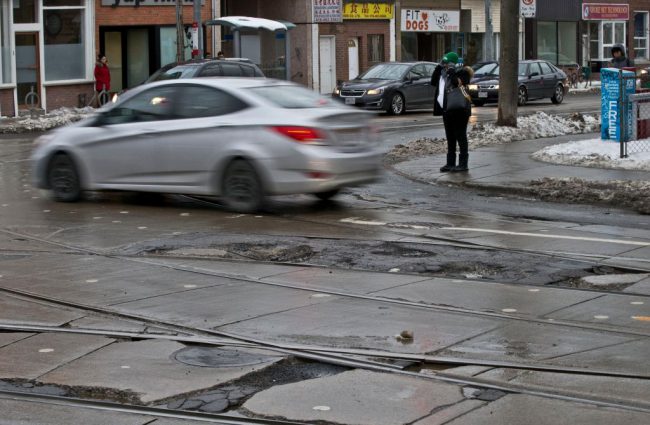 Potholes seen at the intersection of Dundas and Broadview in Toronto's east end.