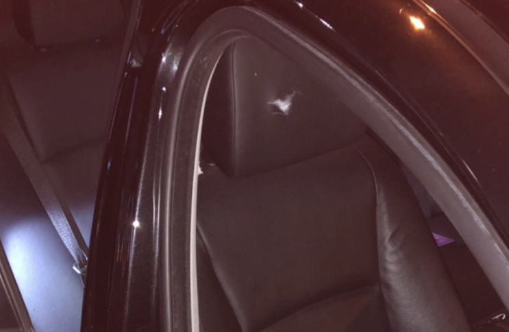 The bullet hole in the headrest where Ralph was sitting. The bullet grazed his cheek.