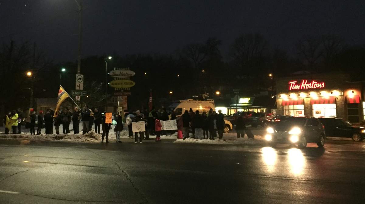 Dozens rallied in front of the Tim Hortons on York Road in Dundas on Wednesday.