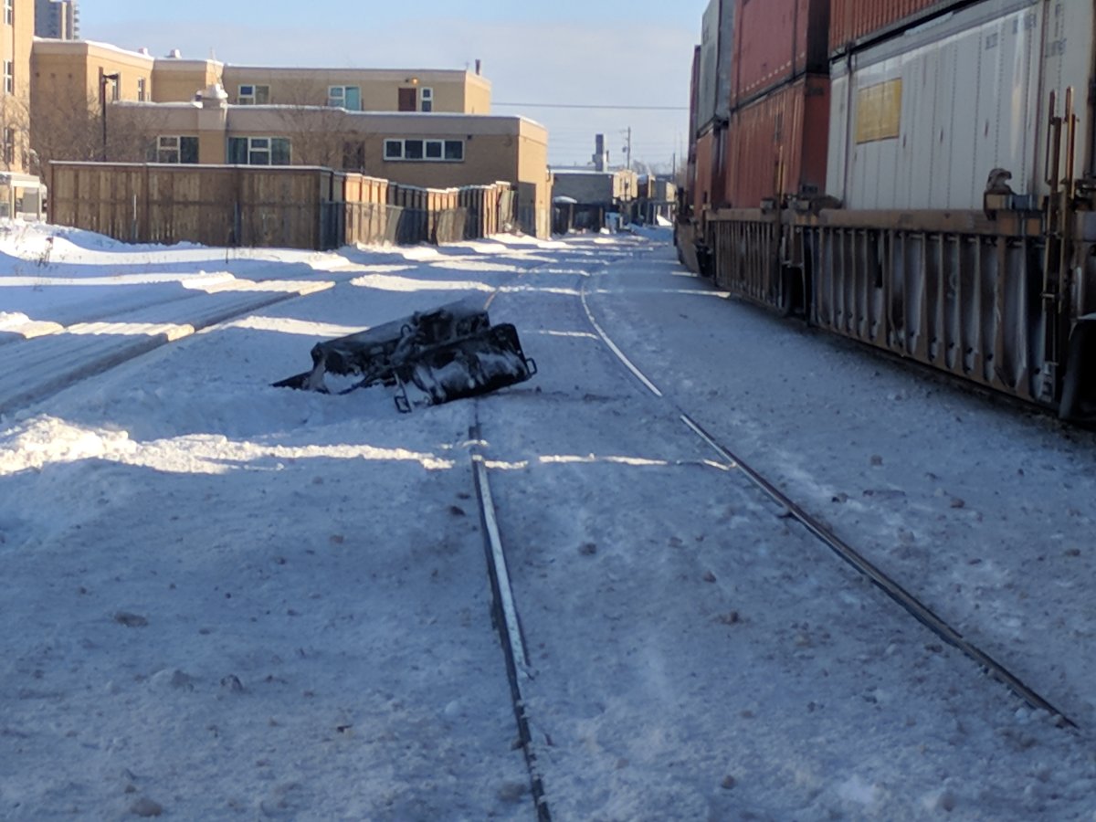 The front scoop of a sidewalk plow can be seen on the north side of the tracks at Colborne St and York St.