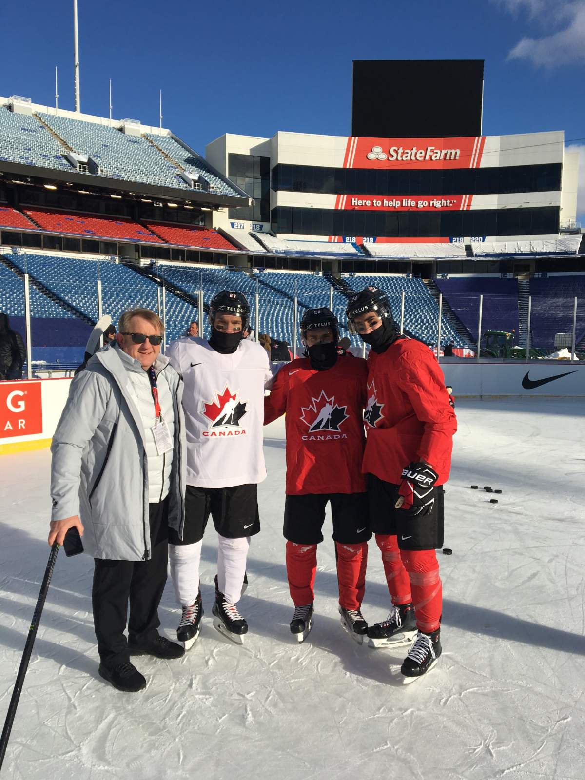 Buffalo, N.Y. Bob Martin, Robert Thomas, Victor Mete and Alex Formenton pose for a picture at New Era Stadium during the 2018 World Junior Hockey Championship.