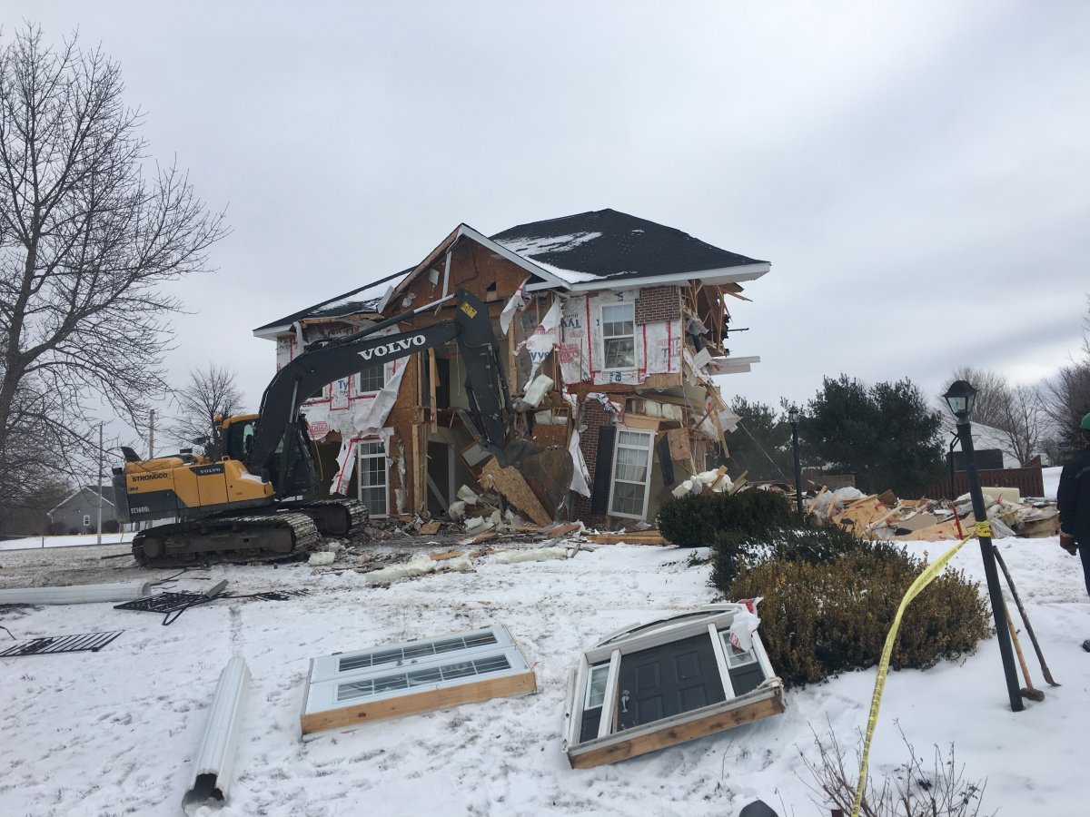 The two-storey home in Falmouth, N.S. fell into a sinkhole last September and was deemed structurally unsafe. It was demolished on Tuesday.
