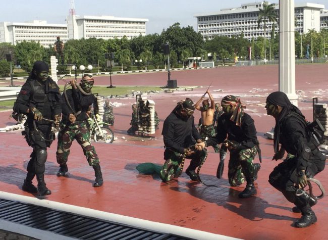 Indonesian special forces demonstrate snake-handling for U.S. Defense Secretary Jim Mattis in Jakarta, Indonesia, Jan. 24, 2018.