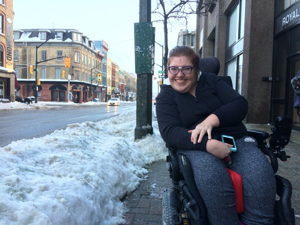 Karli Steen, 26, says she  gets on and off a paratransit bus on Richmond Street each day. But large piles of snow often block the vehicle's ramp, forcing the driver to move the snow or drop her off elsewhere.