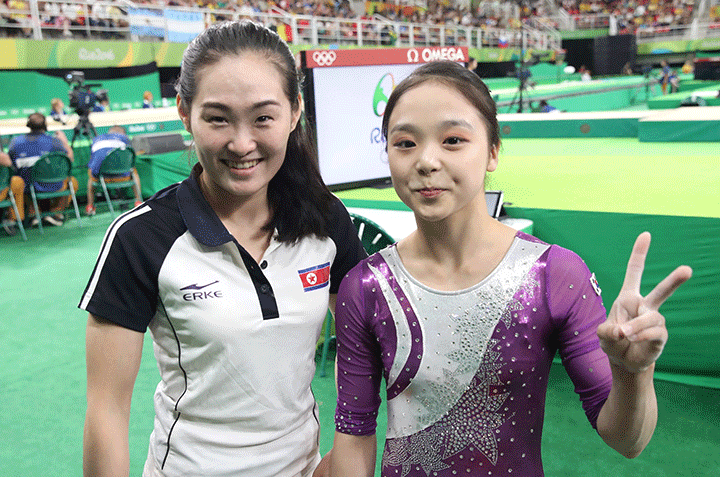 Artistic gymnasts Lee Eun-ju (R) of South Korea and Hong Un-jong of North Korea pose for a photo during the Rio 2016 Olympic Games Artistic Gymnastics events at the Rio Olympic Arena in Barra da Tijuca, Aug. 7, 2016.