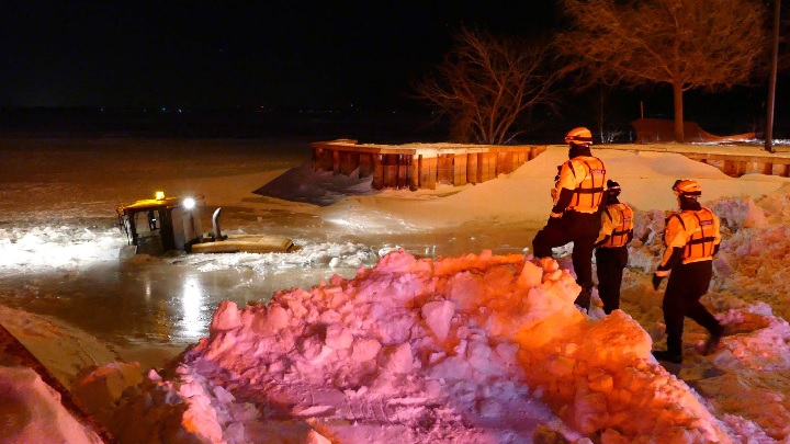 A man was rescued from the icy waters of Lac Saint-Louis on Saturday evening after the small tractor he was driving fell through the ice. Saturday, Jan. 6, 2018.