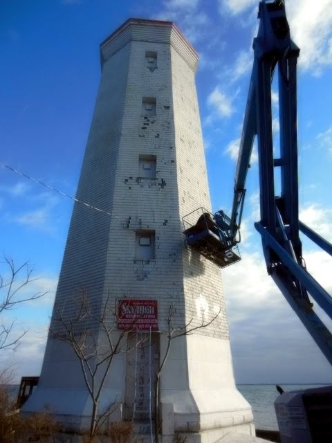 Restoration continues on the Presqu'ile Point lighthouse in Brighton, Ont. The society doing the work has been defrauded of more than $55,000.