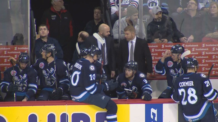 The Manitoba Moose talk things over on the bench during Monday's game against Grand Rapids.