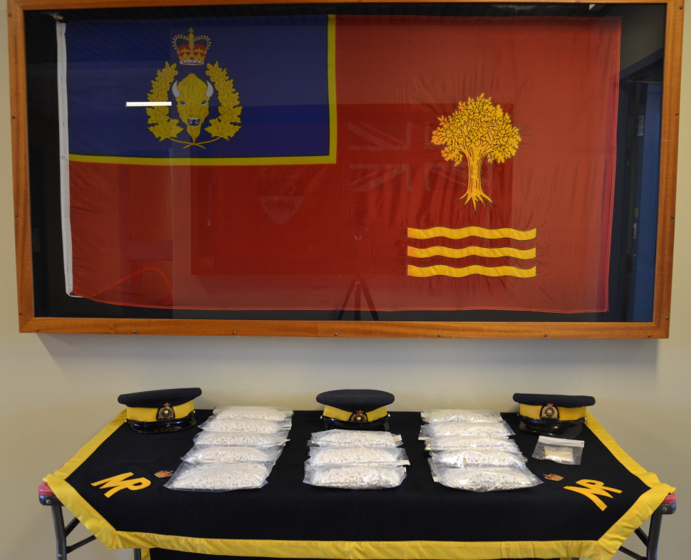 A display of more than 11,000 methamphetamine pills, and a small amount of cocaine seized by RCMP near Edmundston, N.B. 