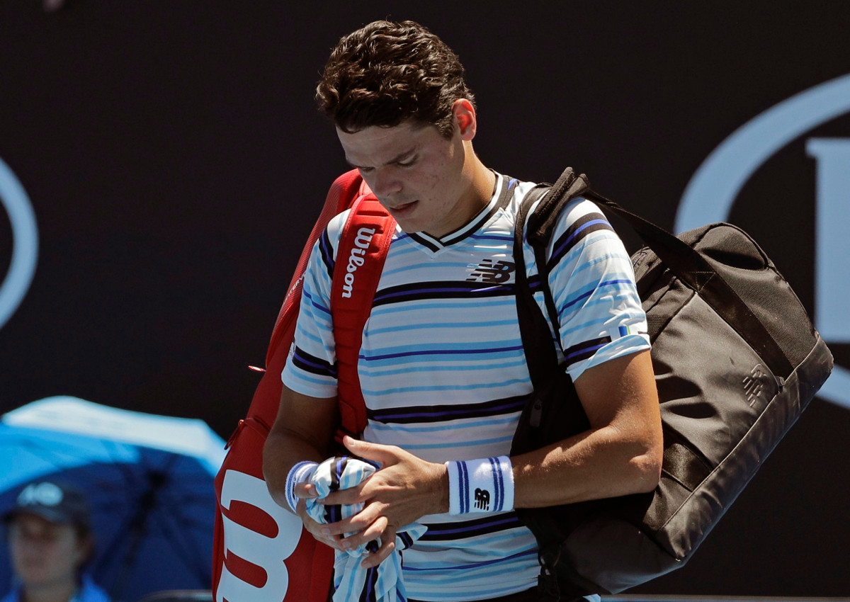 Canada's Milos Raonic leaves the court following his first round loss to Slovakia's Lukas Lacko at the Australian Open tennis championships in Melbourne, Australia, Tuesday, Jan. 16, 2018.