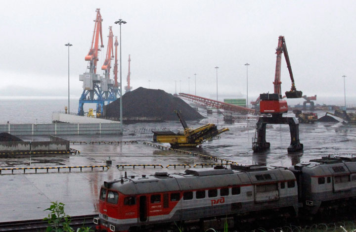 In this July 24, 2016, file photo, coal brought from Siberia is seen awaiting loading onto a ship bound for China in the North Korean special economic zone of Rason. 
