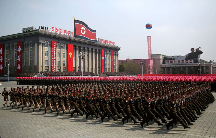 FILE - In this April 15, 2017, file photo, soldiers march across Kim Il Sung Square during a military parade in Pyongyang, North Korea. North Korea is preparing to stage a major event to mark the 70th anniversary of the founding of its military on Feb. 8, 2018 - just one day before the opening ceremony of the Pyeongchang Winter Olympics in South Korea. 