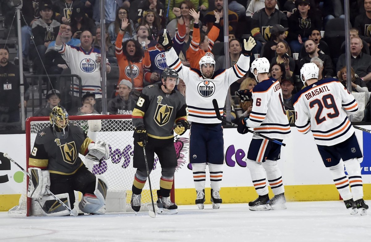 Edmonton Oilers left wing Patrick Maroon (19) celebrates after scoring a goal against Vegas Golden Knights goalie Marc-Andre Fleury, left, during the second period of an NHL hockey game Saturday, Jan. 13, 2018, in Las Vegas. (AP Photo/David Becker).