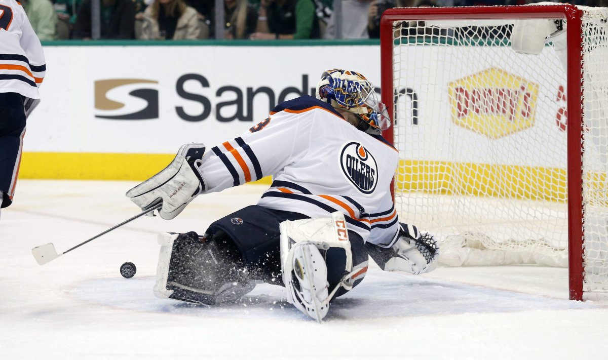 Edmonton Oilers goaltender Cam Talbot has a Dallas Stars shot bounce away from the goal during the second period of an NHL hockey game in Dallas, Saturday, Jan. 6, 2018. 