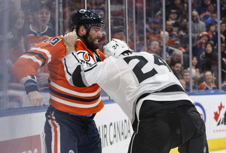 Los Angeles Kings’ Derek Forbort (24) and Edmonton Oilers’ Patrick Maroon (19) fight during second period NHL action in Edmonton, Alta., on Tuesday January 2, 2018.