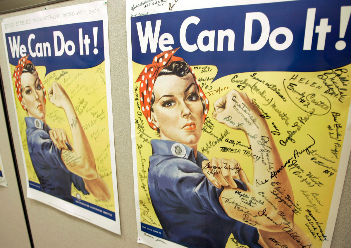 In this Oct. 31, 2007 file photo, a poster showing signatures of former Rosie the Riveter's is seen at the offices of the Rosie the Riveter/World War II Home Front National Historic Park in Richmond, Calif. 