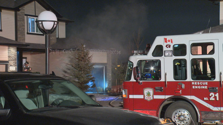 People sleeping in a Saskatoon home were alerted to a fire in their garage by smoke detectors.