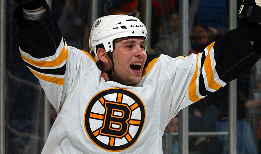 Marc Savard celebrates a goal with the Boston Bruins in 2009. Savard played 13 seasons in the NHL and joins the St. Louis Blues as an assistant coach.