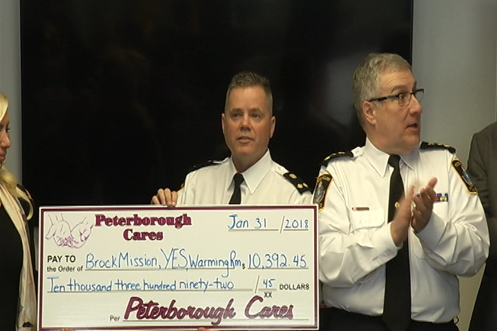 Deputy Peterborough police Chief Tim Farquharson handed the Brock Mission, the Youth Emergency Shelter and the Warming Room just under $3,500 cash on Wednesday at the Water Street police station.