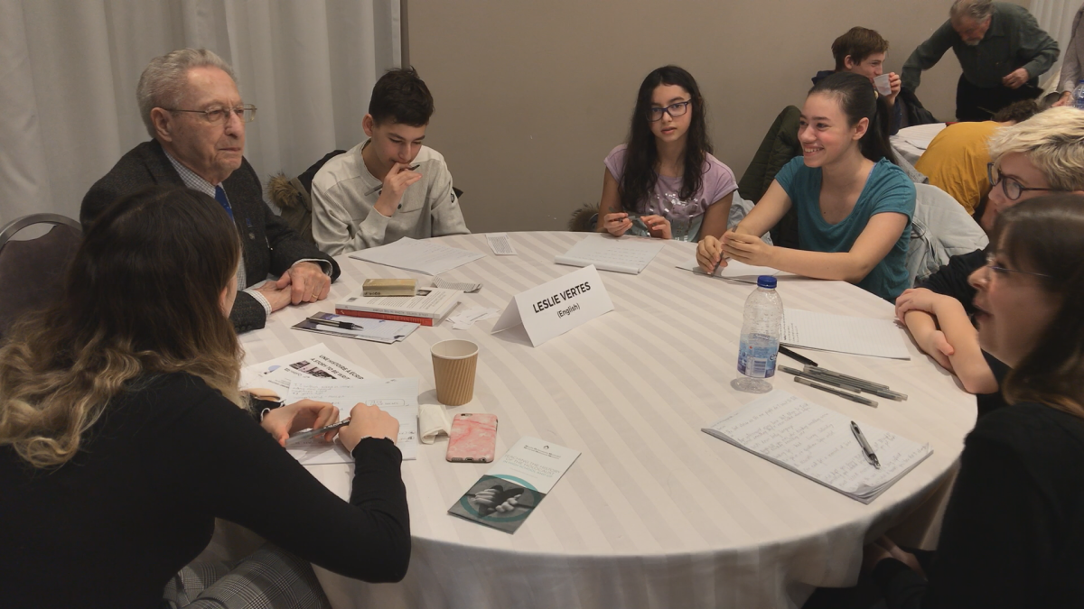 A Holocaust survivor speaks with a group of young writers at the Montreal Holocaust Museum on Sunday, January 28, 2018.